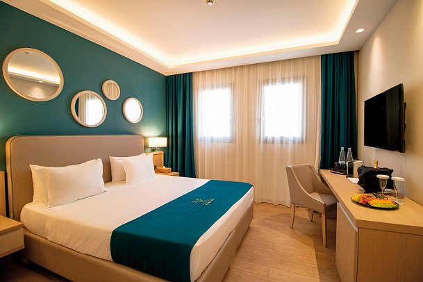 Almyros Beach Resort & Spa - Wohnbeispiel Familienzimmer Gartenblick (Zimmercodierung F2G)