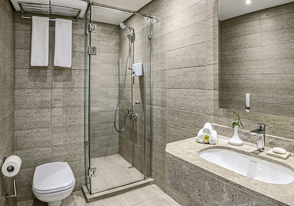 JAZ Fanara Resort & Residence - Beispiel Bad Doppelzimmer Standard Gartenblick (Zimmercodierungen DGG & DCG)