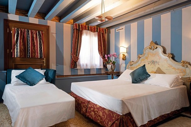 Hotel Tiziano - Wohnbeispiel Dreibettzimmer (Zimmercodierung TB1)