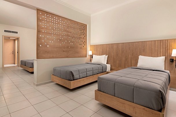 Kresten Palace Hotel - Wohnbeispiel Familienzimmer Gartenblick (Zimmercodierung FBG)